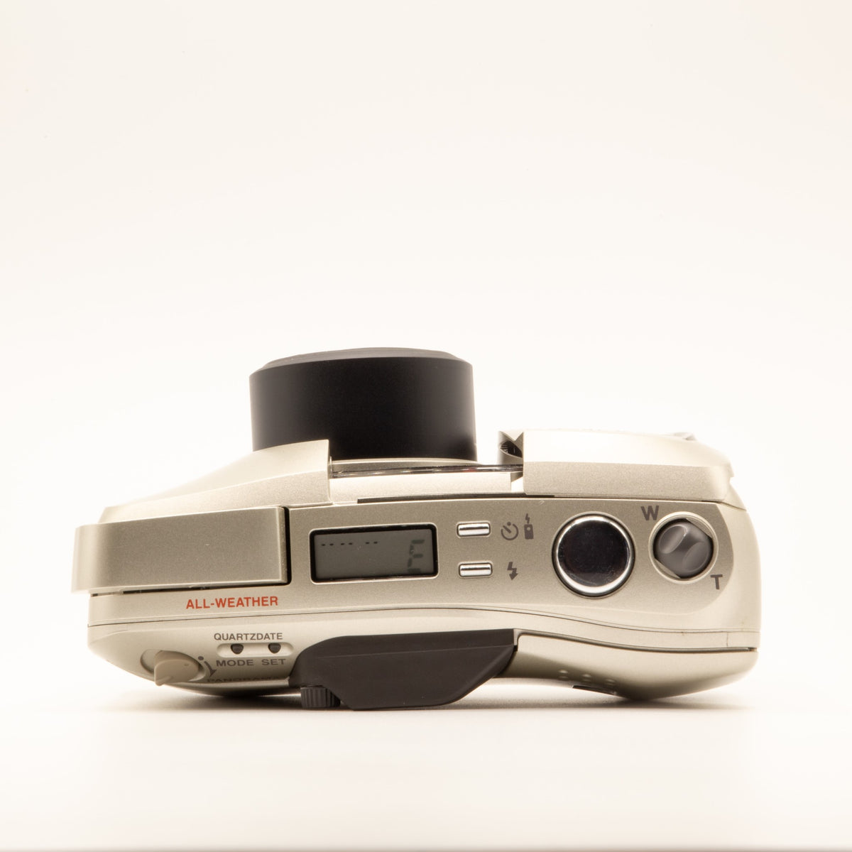 Top plate of the Olympus MJU Zoom 140 35mm film camera showing shutter button and dials