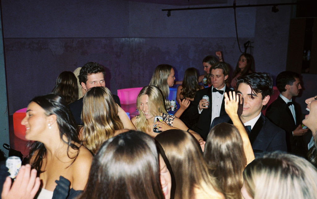 A group of teenagers having a good time partying