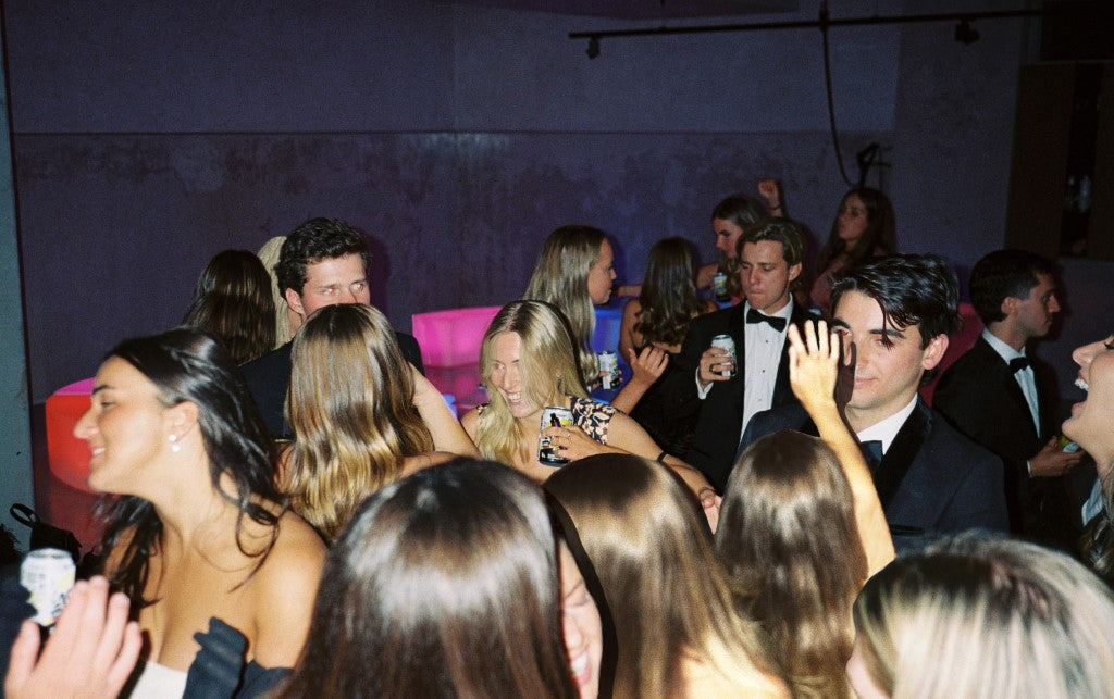 A group of teenagers having a good time partying