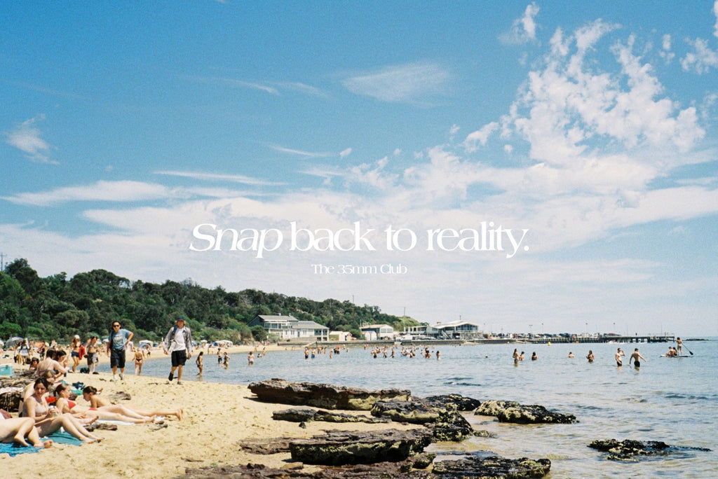 Our slogan 'Snap back to reality' over a photo of people at the beach