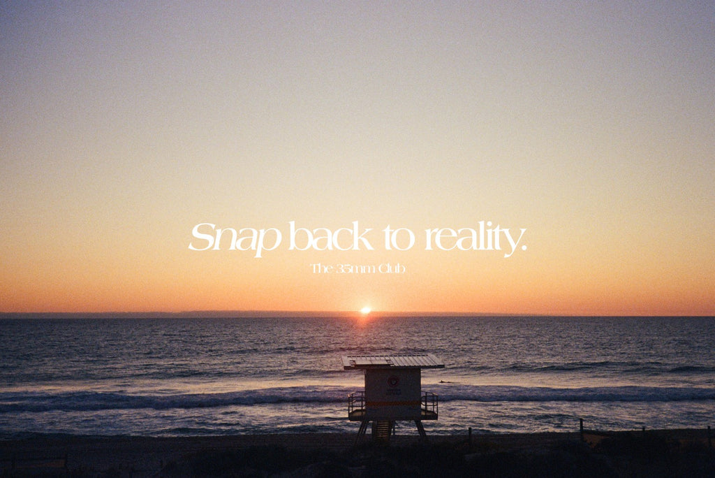 Our slogan 'Snap back to reality' over a photo of the sun setting by the beach