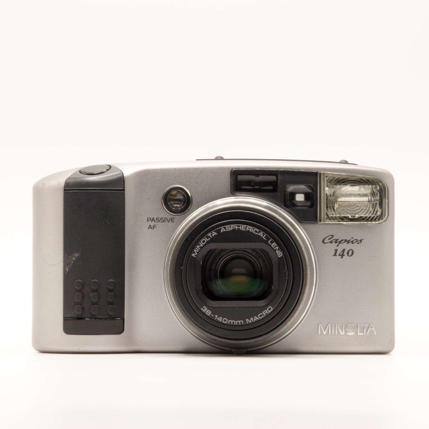 A photo of a vintage grey Minolta 35mm point-and-shoot film camera