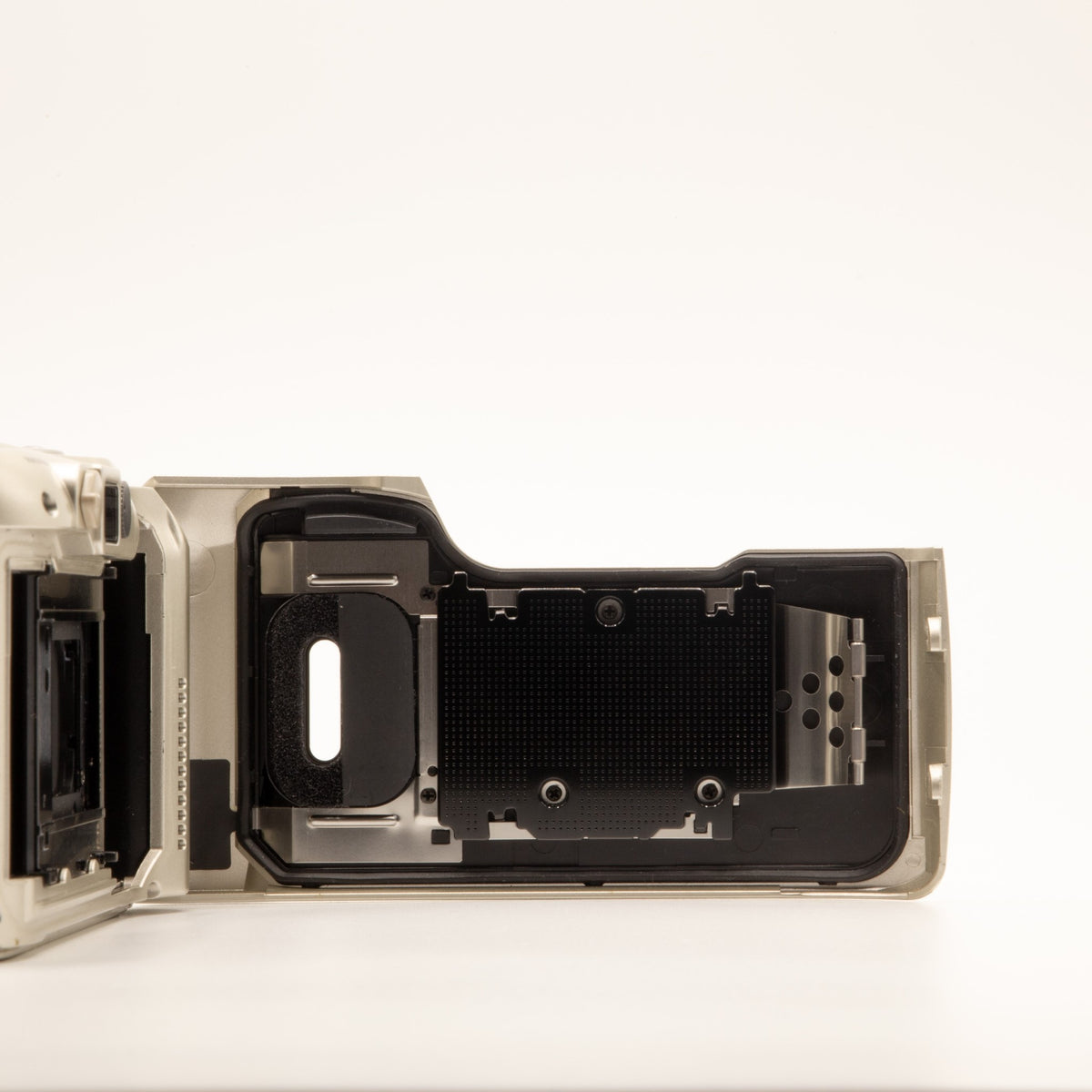 Olympus MJU II 115 VF film chamber door internals, showing the 35mm film loading mechanism