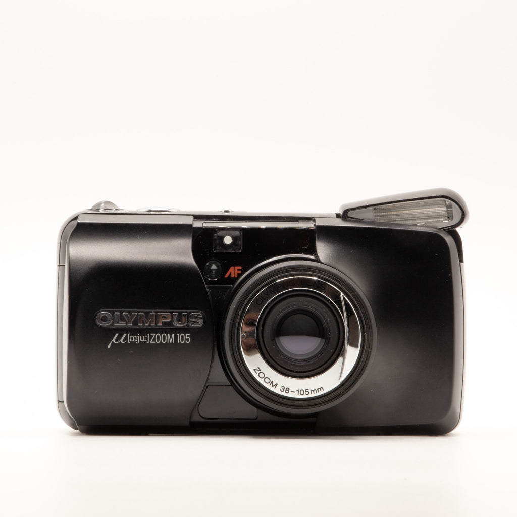 A photo of a vintage Black Olympus 35mm point-and-shoot film camera