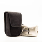 a photo of a olympus film camera case, with the fabric being velour