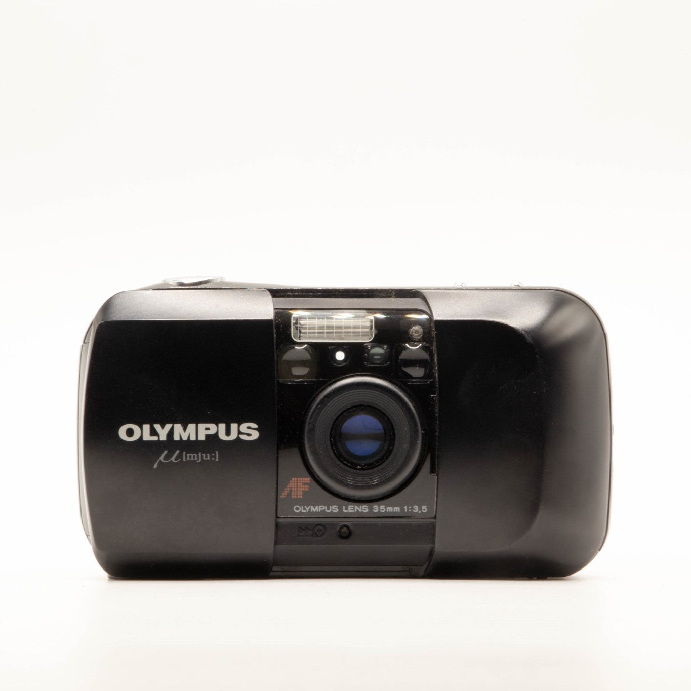 a Photo of an vintage olympus 35mm point-and-shoot film camera