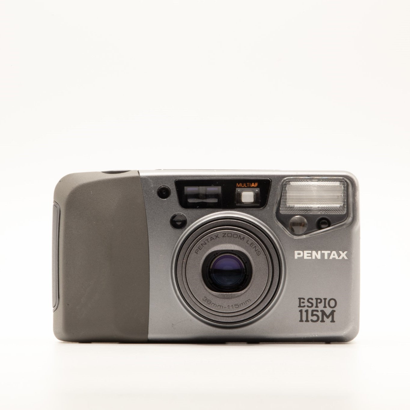 A photo of a vintage grey Pentax 35mm point-and-shoot film camera